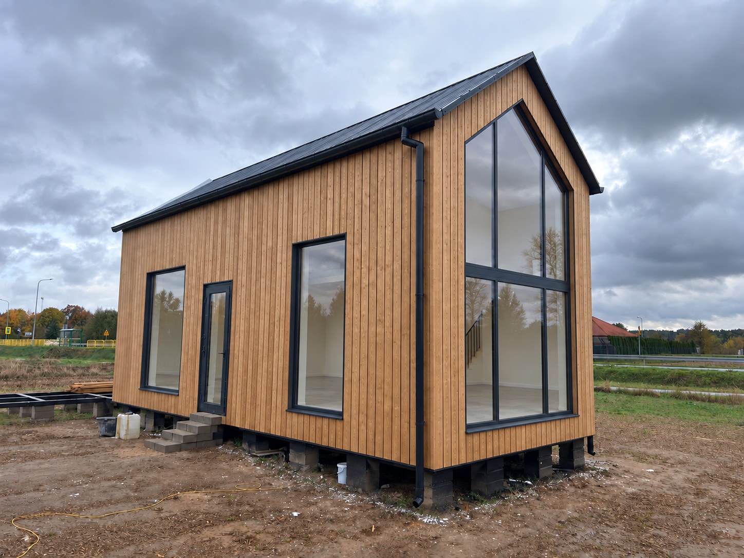 Combstruct home with a timber facade and large windows